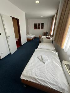 Posteľ alebo postele v izbe v ubytovaní Hotel Remy