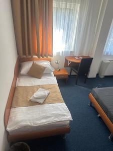 Posteľ alebo postele v izbe v ubytovaní Hotel Remy