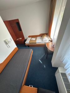 Posteľ alebo postele v izbe v ubytovaní Hotel Remy