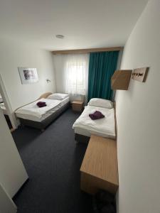 Posteľ alebo postele v izbe v ubytovaní Hotel Remy