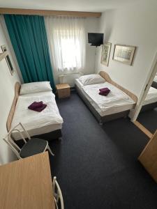 Posteľ alebo postele v izbe v ubytovaní Hotel Remy