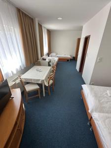 Posteľ alebo postele v izbe v ubytovaní Hotel Remy