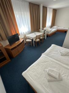 Posteľ alebo postele v izbe v ubytovaní Hotel Remy