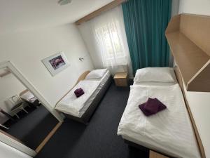 Posteľ alebo postele v izbe v ubytovaní Hotel Remy
