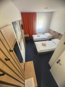 Posteľ alebo postele v izbe v ubytovaní Hotel Remy