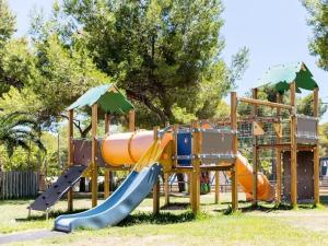 a playground with a slide in a park at House Caparica in Costa da Caparica
