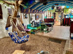 a living room with a tree and swings at Villa Andalusia Dahab blue in Dahab +22 photos