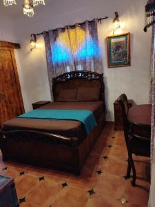 a bedroom with a large bed in a room at Villa Andalusia Dahab blue in Dahab