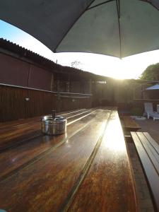 a bowling alley with two buckets on top of it at Tri M Waves Lodge in Ponta do Ouro