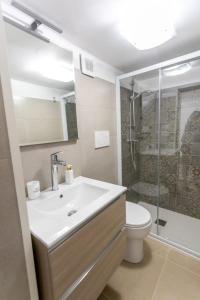 a bathroom with a sink and a toilet and a shower at casa vacanze Diletta in Santa Maria al Bagno