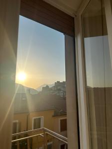 a window with a view of a city at House Nonna Nina in Celano