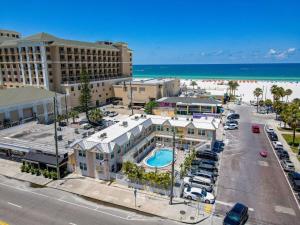 an aerial view of a resort with a pool and the beach at Clearwater Beach Suites #104 in Clearwater Beach