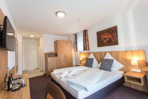 Postel nebo postele na pokoji v ubytování Schäfer Boardinghouse