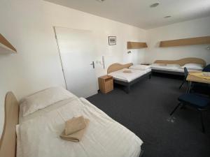 Posteľ alebo postele v izbe v ubytovaní Hotel Remy