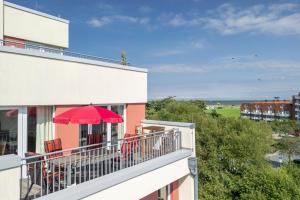 Rõdu või terrass majutusasutuses NordseeResort Friesland NordseeResort Friesland 52-4-S