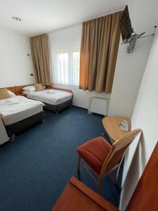 Posteľ alebo postele v izbe v ubytovaní Hotel Remy