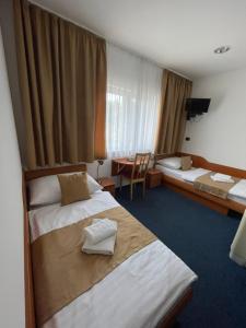 Posteľ alebo postele v izbe v ubytovaní Hotel Remy