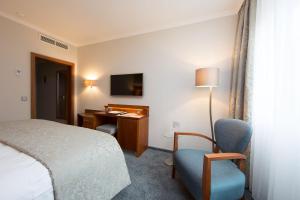 TV a/nebo společenská místnost v ubytování Hotel Oranien Wiesbaden
