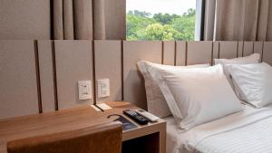 Plaza Hotel & Boulevard Convention - Vale dos Vinhedos客房内的一张或多张床位
