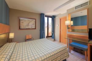 เตียงในห้องที่ Hotel del Mar