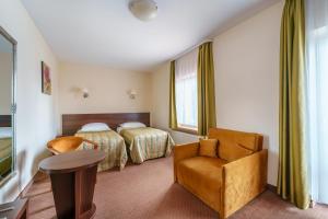 Łóżko lub łóżka w pokoju w obiekcie Hotel Pod Szrenicą