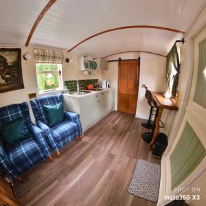a living room and kitchen in a tiny house at Alices Garden Two in York