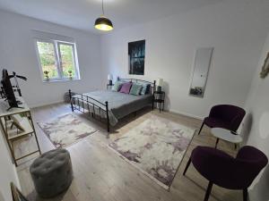 En eller flere senge i et værelse på Central City Residence