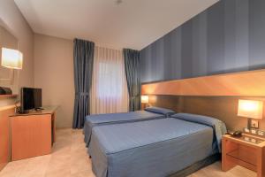 เตียงในห้องที่ Hotel del Mar