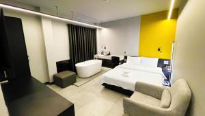 Postel nebo postele na pokoji v ubytování A In Hotel Atistar