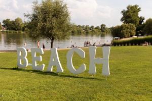 a sign in a park with people in the water at Radisson Hotel Budapest BudaPart in Budapest