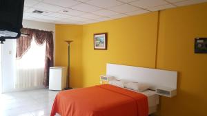 Rúm í herbergi á Hotel Juan Sebastián
