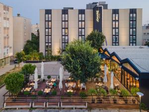 an overhead view of a building with tables and trees at Hotel A'mare in Zadar
