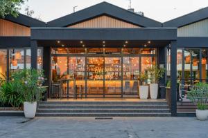 a store front of a building with plants at Hotel A'mare in Zadar