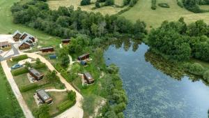an aerial view of a house and a lake at Bleu Minuit La Rive Etoilée in Thézillieu +22 photos