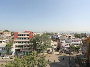 a view of a city with buildings at Hotel Global Inn in Udaipur