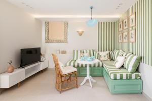 a living room with a couch and a table at Fancy Pyramids View Khan Giza's Gem in Cairo