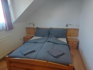 A bed or beds in a room at Apartman116 Airport