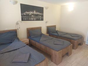 A bed or beds in a room at Apartman116 Airport