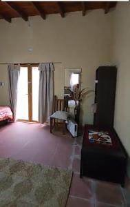 a living room with a couch and a window at Apart Robert A in Chilecito