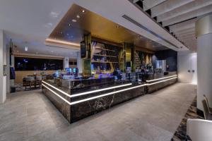 a lobby with a bar with blue glasses at Sydney Private Home in Bankstown