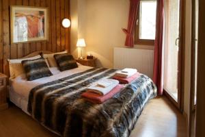 Ένα ή περισσότερα κρεβάτια σε δωμάτιο στο Morzine Barn