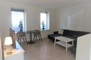 a living room with a couch and a table at 144Nygårdsvej (id.168) in Esbjerg