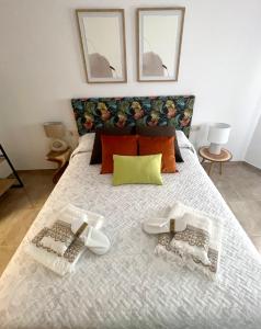 Ένα ή περισσότερα κρεβάτια σε δωμάτιο στο Tiempo de Cerezas