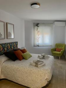 Ένα ή περισσότερα κρεβάτια σε δωμάτιο στο Tiempo de Cerezas