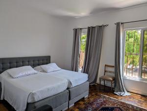 Postel nebo postele na pokoji v ubytování Casa Estrela - Sea & Art Guesthouse