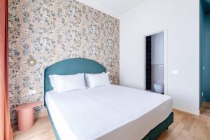 Postel nebo postele na pokoji v ubytování UNICO Suite - GRUPPO BLAM