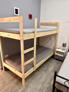 Un pat sau paturi într-o cameră la B&B I TRE SANTI