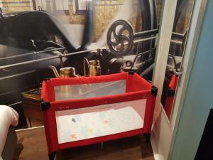 a red tool box sitting inside of a machine at Appartement De Oliekan Medium in Lemmer