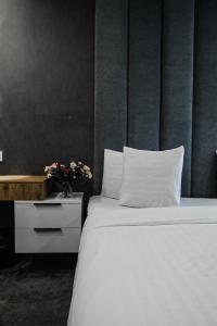 Voodi või voodid majutusasutuse London Hotel Yerevan toas