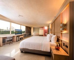 Postel nebo postele na pokoji v ubytování Mood Matuna Hotel Cartagena